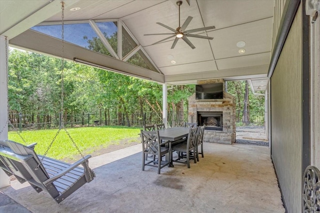 10 Holland St, Pottsboro, TX 75076 - view of patio / terrace with an outdoor stone fireplace, a ceiling fan, and outdoor dining space