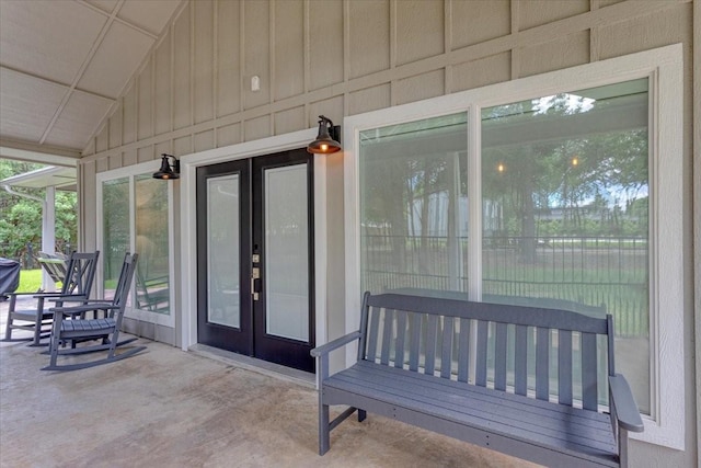 10 Holland St, Pottsboro, TX 75076 - entrance to property with board and batten siding, french doors, and a patio area
