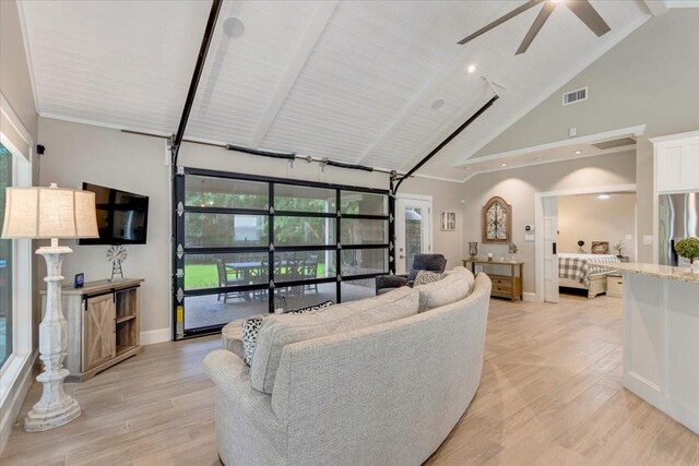 10 Holland St, Pottsboro, TX 75076 - living room with high vaulted ceiling, ceiling fan, baseboards, light wood-type flooring, and beam ceiling