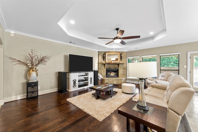 10528 Lago Vis, Quinlan, TX 75474 - living room with a ceiling fan, ornamental molding, a raised ceiling, a fireplace, and dark wood-style floors