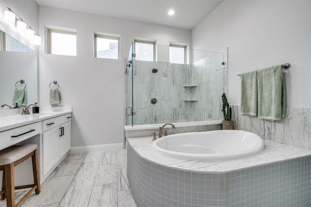 full bath featuring a stall shower, a wealth of natural light, vanity, and a bath