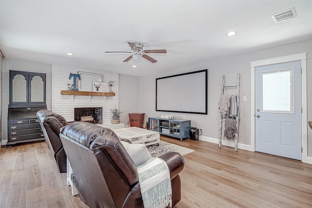 509 Oak St, Burleson, TX 76028 - home theater room featuring ceiling fan, light wood-style flooring, baseboards, and visible vents