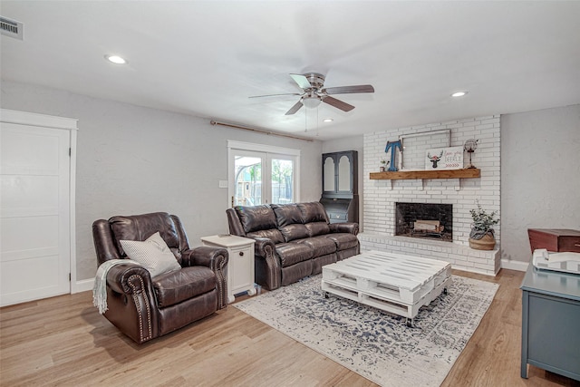 509 Oak St, Burleson, TX 76028 - living room featuring a ceiling fan, light wood-style flooring, a brick fireplace, recessed lighting, and baseboards
