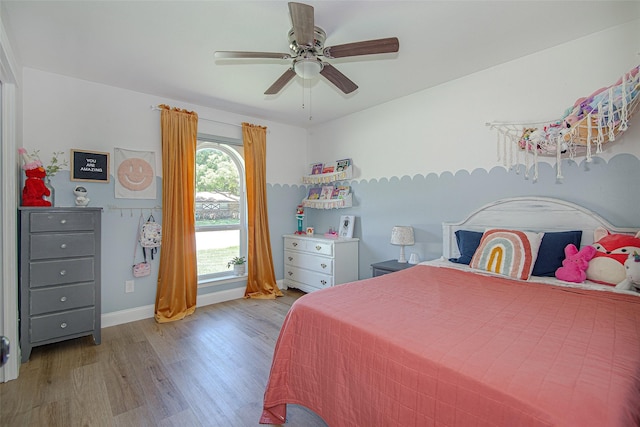 509 Oak St, Burleson, TX 76028 - bedroom featuring wood finished floors, baseboards, and a ceiling fan