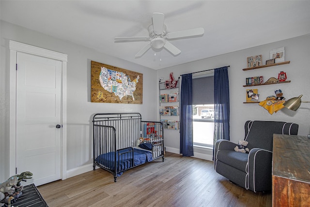 509 Oak St, Burleson, TX 76028 - bedroom featuring a ceiling fan, wood finished floors, and baseboards