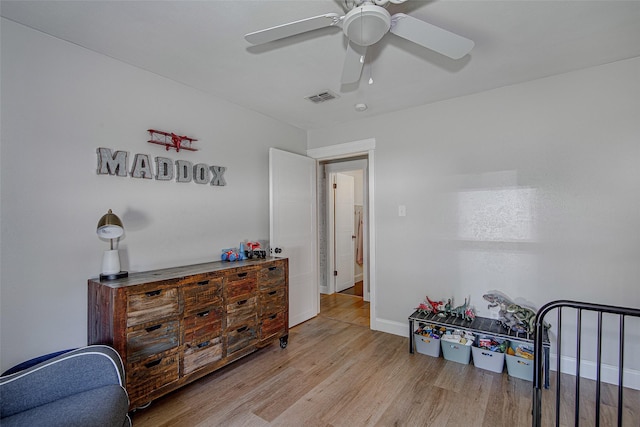 509 Oak St, Burleson, TX 76028 - bedroom featuring baseboards, ceiling fan, visible vents, and wood finished floors