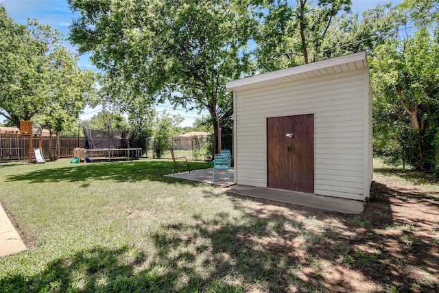 509 Oak St, Burleson, TX 76028 - view of yard featuring a trampoline, an outbuilding, a fenced backyard, and a playground
