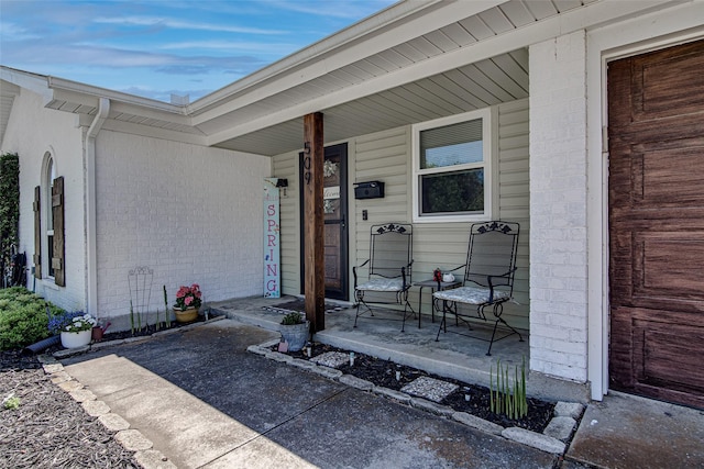 509 Oak St, Burleson, TX 76028 - property entrance featuring covered porch and brick siding