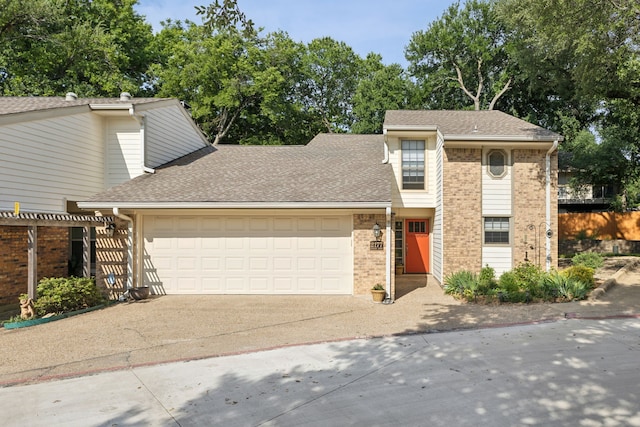 2177 Kessler Ct Unit 6, Dallas, TX 75208 - view of front of property with roof with shingles, an attached garage, brick siding, and driveway