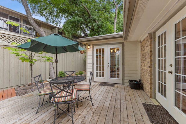 2177 Kessler Ct Unit 6, Dallas, TX 75208 - wooden terrace with outdoor dining area, french doors, and fence