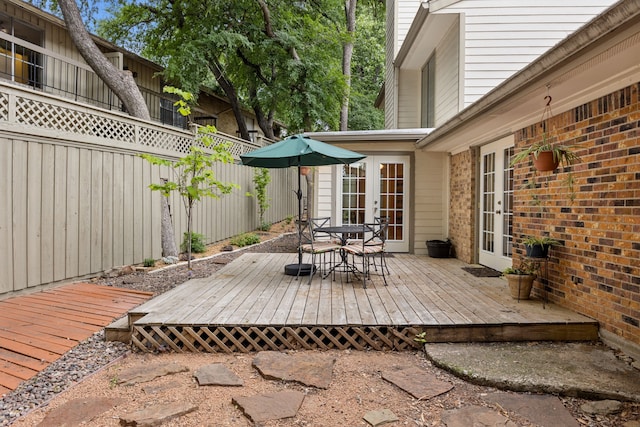 2177 Kessler Ct Unit 6, Dallas, TX 75208 - wooden terrace with fence, french doors, and outdoor dining space