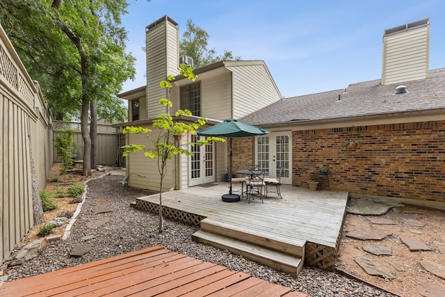 2177 Kessler Ct Unit 6, Dallas, TX 75208 - wooden terrace featuring french doors and a fenced backyard