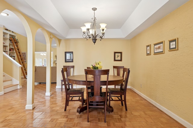 2177 Kessler Ct Unit 6, Dallas, TX 75208 - dining space with a chandelier, stairs, baseboards, and a raised ceiling