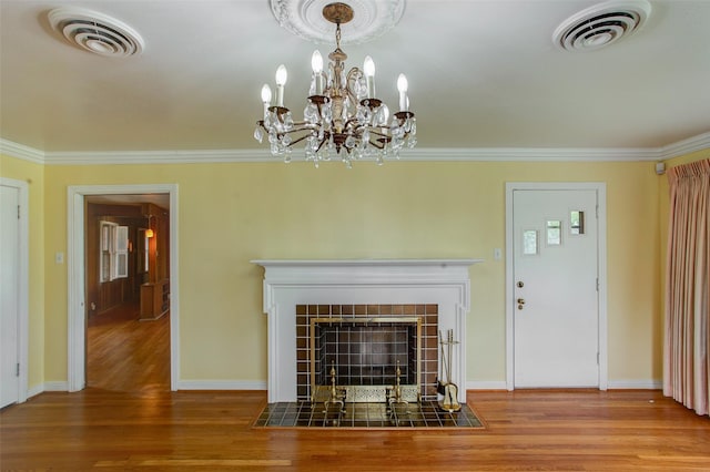 2000 Standifer St, Fort Worth, TX 76164 - unfurnished living room featuring wood finished floors, a fireplace, ornamental molding, and a chandelier
