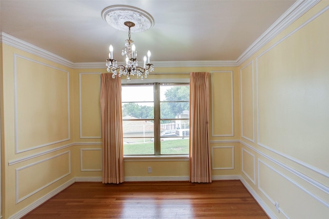 2000 Standifer St, Fort Worth, TX 76164 - spare room with a decorative wall, a chandelier, wood finished floors, and crown molding