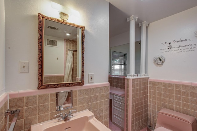 2000 Standifer St, Fort Worth, TX 76164 - bathroom featuring toilet, tile walls, wainscoting, and visible vents