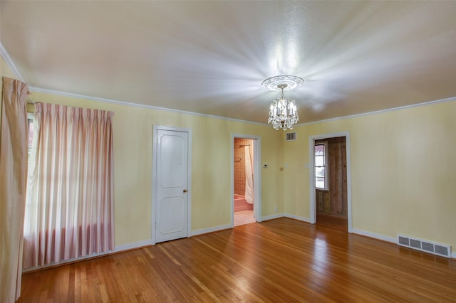 2000 Standifer St, Fort Worth, TX 76164 - empty room featuring a chandelier, wood finished floors, and crown molding