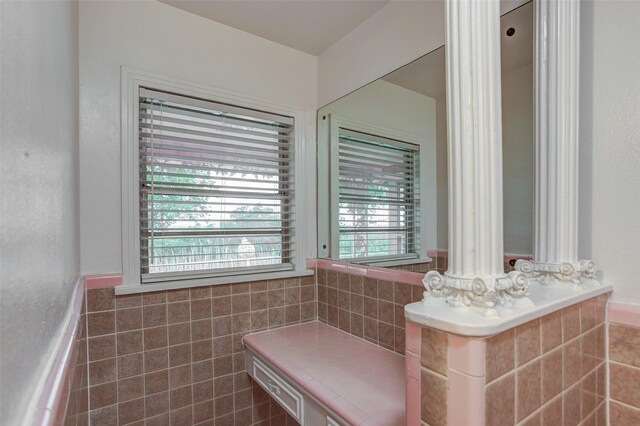 2000 Standifer St, Fort Worth, TX 76164 - bathroom featuring tile walls and a wainscoted wall