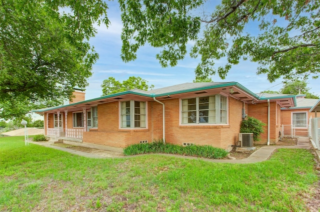 2000 Standifer St, Fort Worth, TX 76164 - view of side of home with fence, central AC, brick siding, a chimney, and a lawn