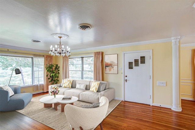 2000 Standifer St, Fort Worth, TX 76164 - living room with wood finished floors, a chandelier, and crown molding