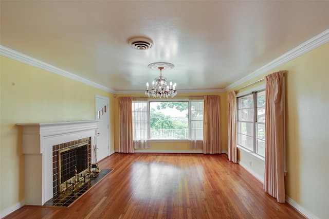 2000 Standifer St, Fort Worth, TX 76164 - unfurnished living room with a tiled fireplace, wood finished floors, baseboards, and a notable chandelier