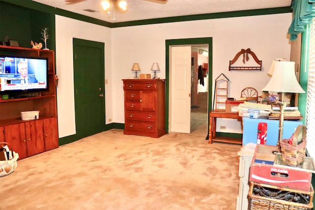 interior space with a ceiling fan, baseboards, and carpet floors