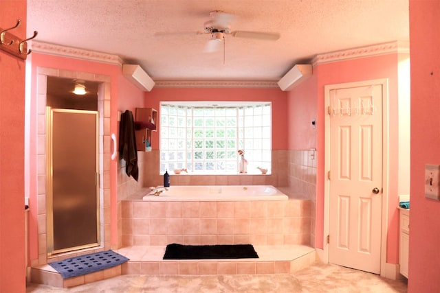full bathroom with a bath, a textured ceiling, a shower stall, and ceiling fan