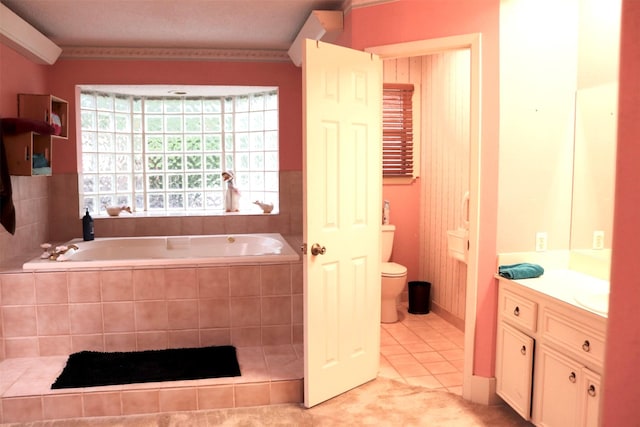 bathroom with tile patterned floors, a bath, toilet, and vanity
