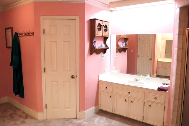 bathroom featuring baseboards and vanity