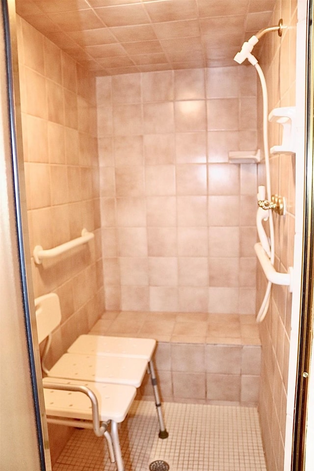 full bathroom featuring a stall shower and tile patterned flooring