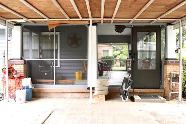 property entrance featuring brick siding