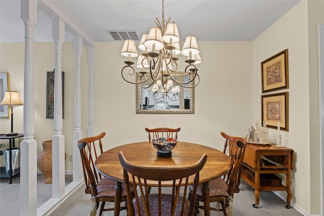 dining area featuring an inviting chandelier, carpet floors, baseboards, and visible vents