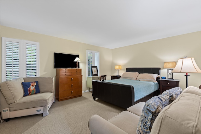 bedroom with light carpet