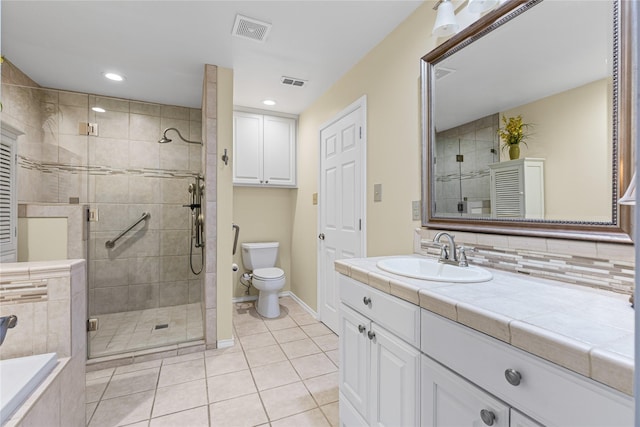 full bathroom featuring a shower stall, toilet, tile patterned floors, and visible vents