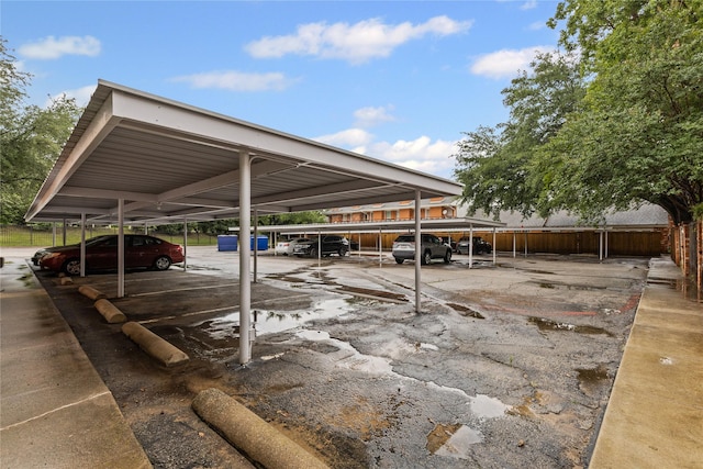 covered parking lot with fence