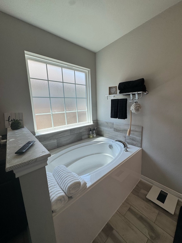 full bathroom with a garden tub