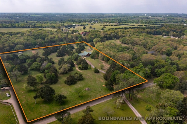 birds eye view of property with a rural view