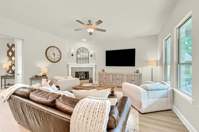 1504 Bearpath Way, Gunter, TX 75058 - living area featuring light wood-style flooring, a wealth of natural light, a high end fireplace, and a ceiling fan