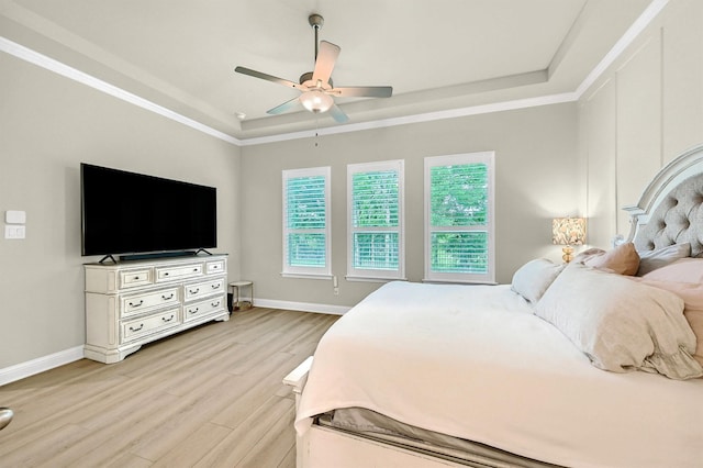 1504 Bearpath Way, Gunter, TX 75058 - bedroom with a ceiling fan, crown molding, light wood-type flooring, baseboards, and a raised ceiling