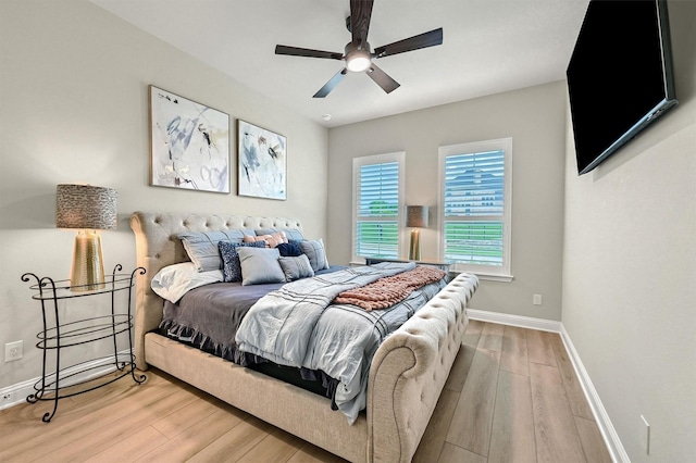 1504 Bearpath Way, Gunter, TX 75058 - bedroom with baseboards, a ceiling fan, and wood finished floors