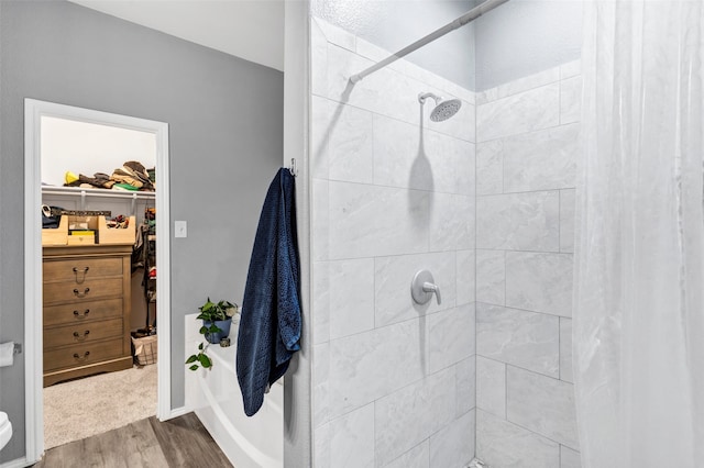221 Brookdale Dr, Midlothian, TX 76065 - full bath featuring wood finished floors, a tile shower, and a spacious closet