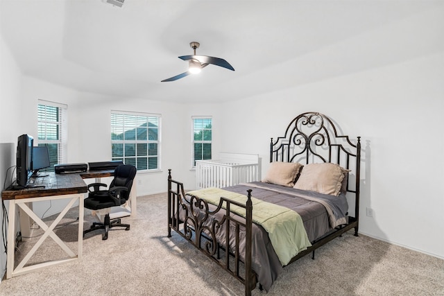 carpeted bedroom featuring a ceiling fan