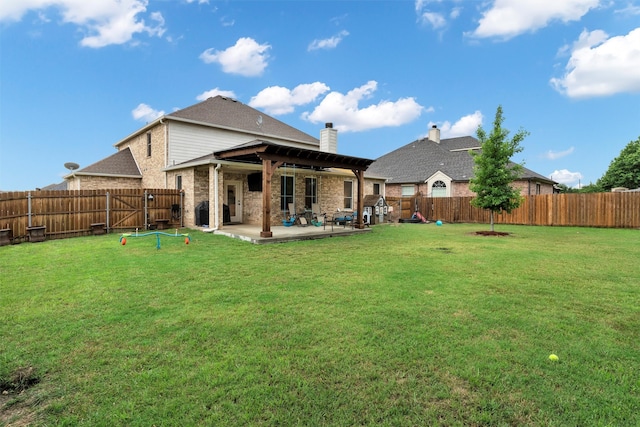 back of property featuring a fenced backyard, a patio area, a yard, and brick siding