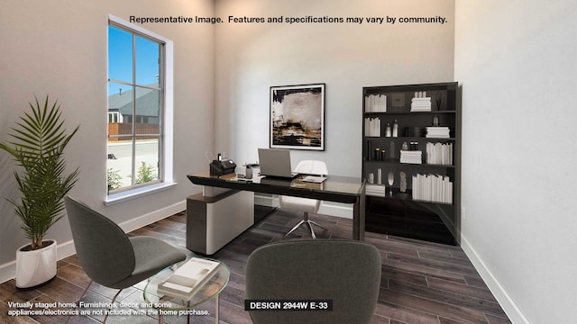 office with wood finish floors, baseboards, and a towering ceiling