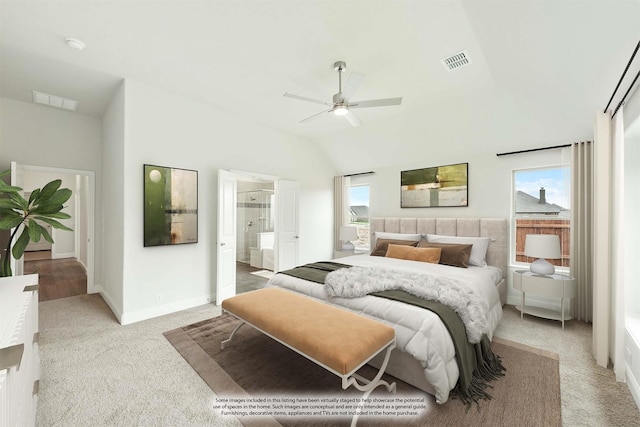 bedroom with vaulted ceiling, light colored carpet, ensuite bath, and visible vents
