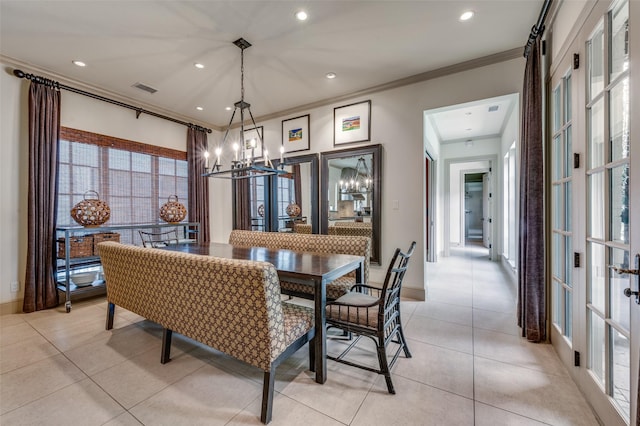 dining room with light tile patterned floors, a notable chandelier, crown molding, visible vents, and recessed lighting