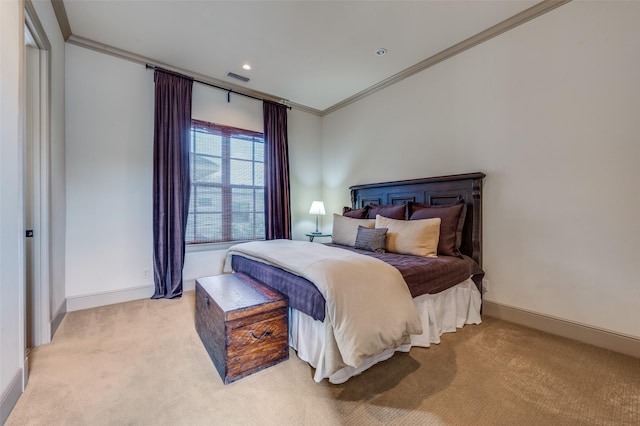 bedroom with crown molding, visible vents, baseboards, and carpet