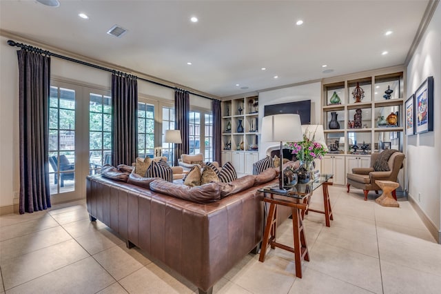 living room with built in shelves, crown molding, light tile patterned floors, and recessed lighting