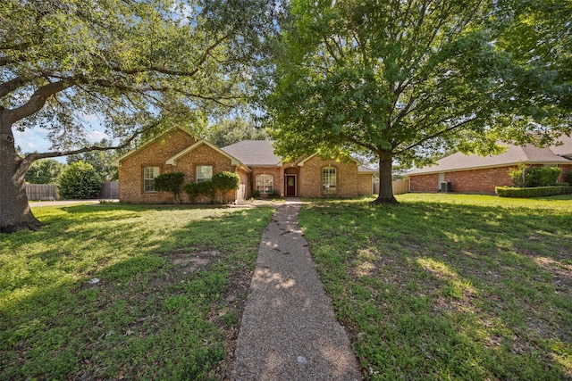 609 S Ruidoso Downs Dr, Robinson, TX 76706 - single story home with a front yard, brick siding, and fence