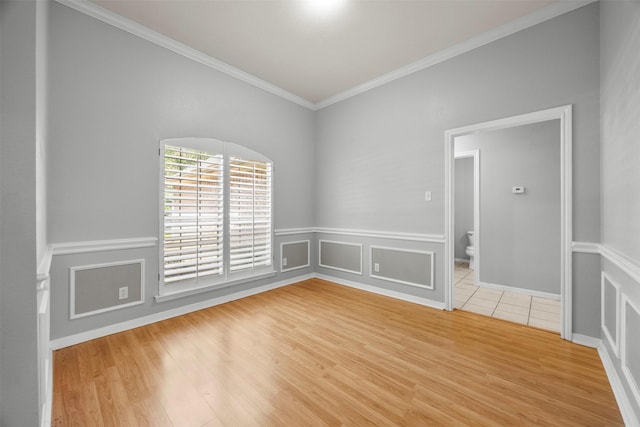 609 S Ruidoso Downs Dr, Robinson, TX 76706 - empty room with crown molding and light wood-style flooring